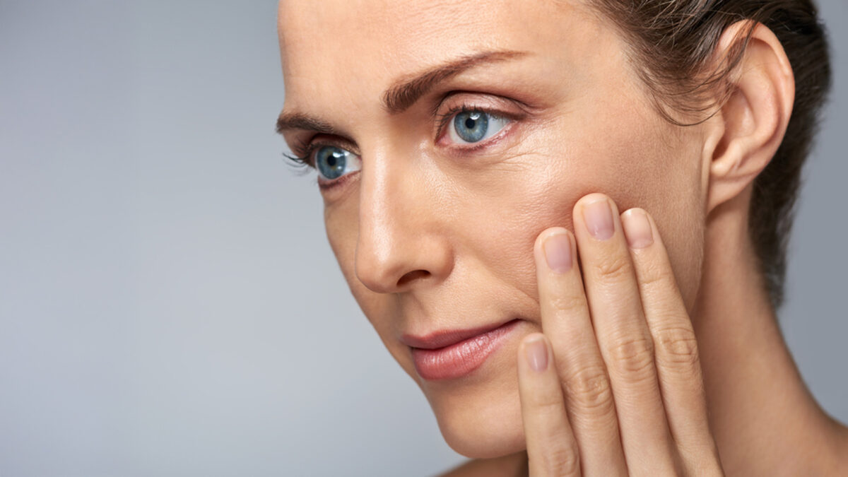 a woman touching her face